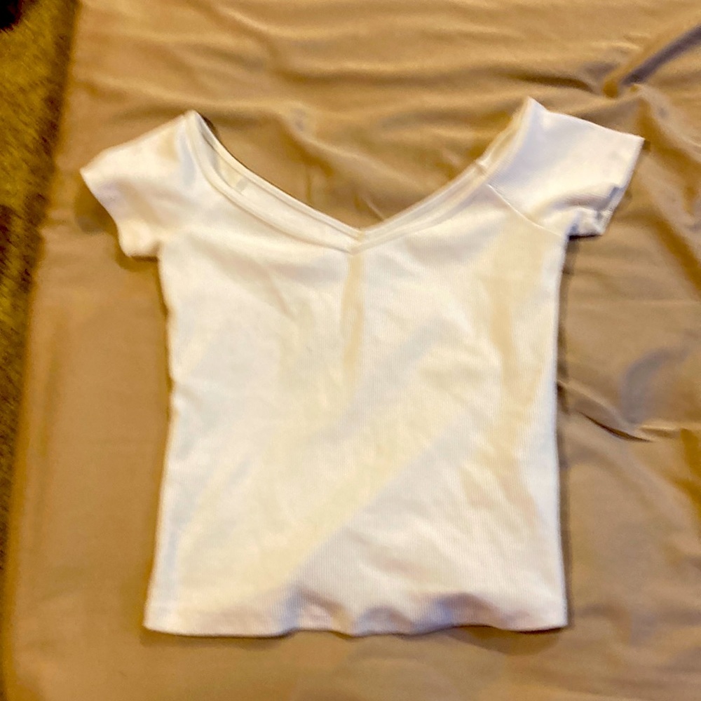 It’s white size small brand name Abercrombie and finch it’s a crop top